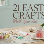 Pastel dyed Easter eggs, a white paper bunny cutout with a pink cotton tail, and a glass jar of pink eggs arranged on a wooden table with scissors and twine for a spring DIY craft session.