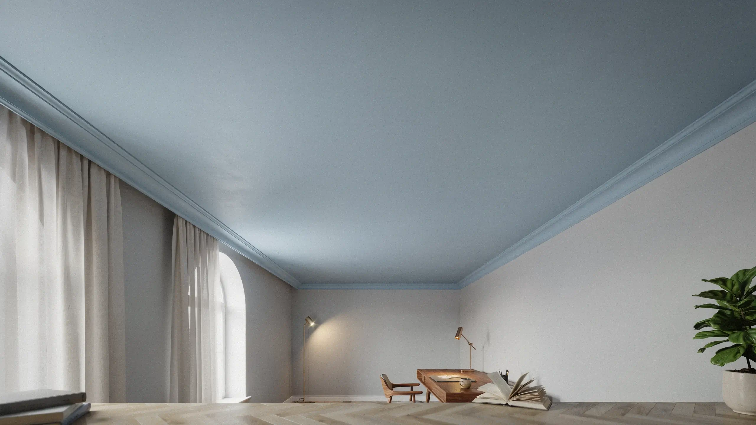 Minimalist interior with a light blue painted ceiling and white crown molding that visually adds height, featuring a large arched window, wooden desk, and potted green plant.