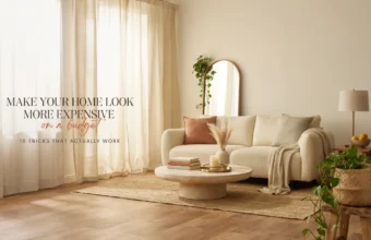 A bright, airy living room styled on a budget featuring a cream boucle sofa, jute rug, and pampas grass, showcasing 16 easy tricks to make a home look more expensive.