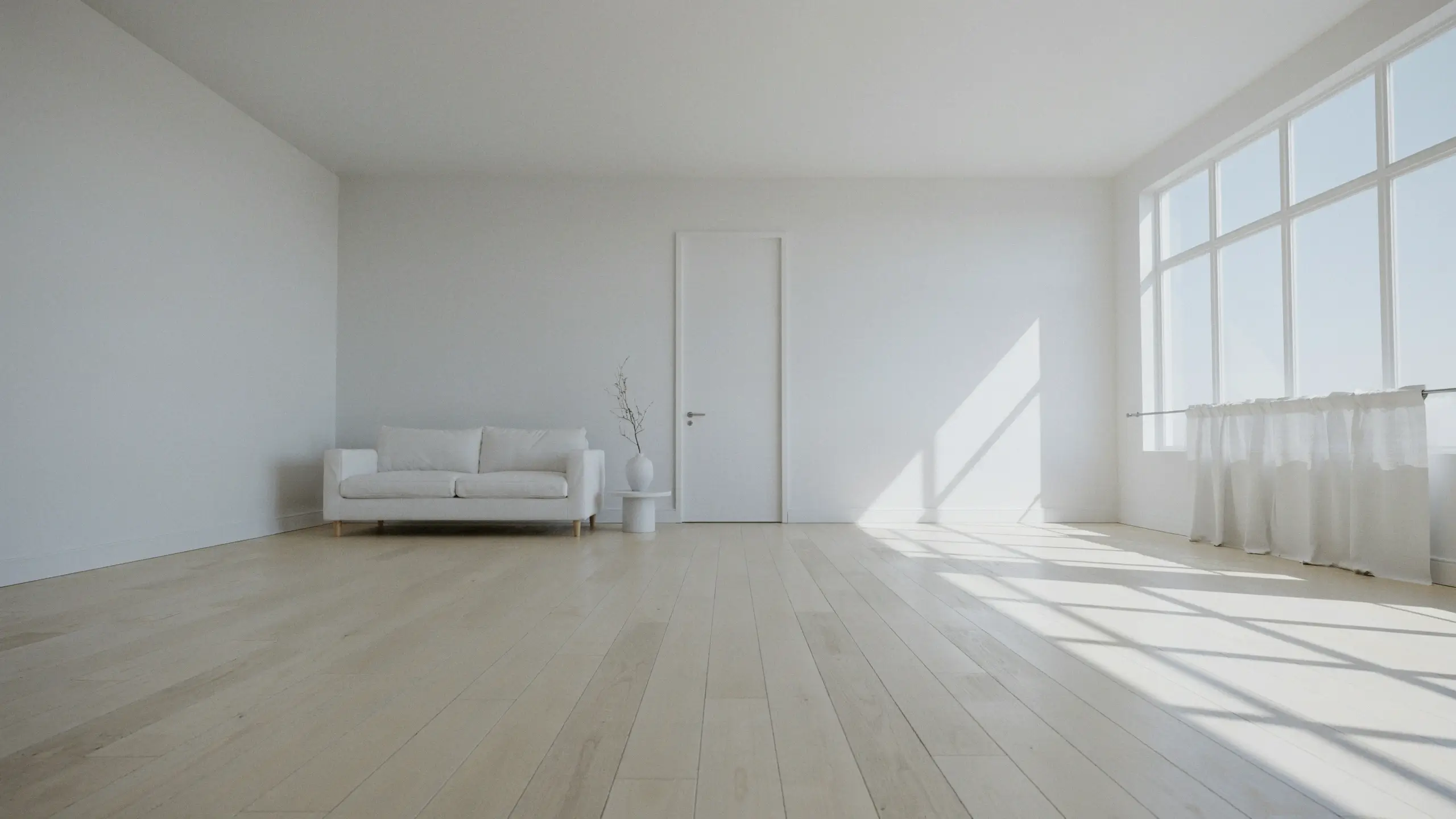A bright, minimalist white living room featuring a white two-seater sofa, a white interior door, sheer curtains, and a simple pedestal table with a vase, showcasing strong diagonal natural sunlight casting geometric shadows across a light-wood plank floor.
