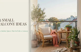 A cozy small balcony decorated with a rattan armchair, white cushions, and a pink throw blanket. An olive tree and snake plant bring greenery to the space, next to a small table holding a mug and an open book. The scene is lit by string lights with text reading "25 Small Balcony Ideas
