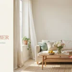 A bright, airy spring-to-summer living room featuring a cream sofa, light wood coffee table with fresh flowers and lemons, and sheer natural curtains for a seasonal home refresh.